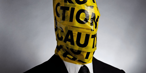 The Cost of a Bad Hire | Man with Caution Tape Around Head