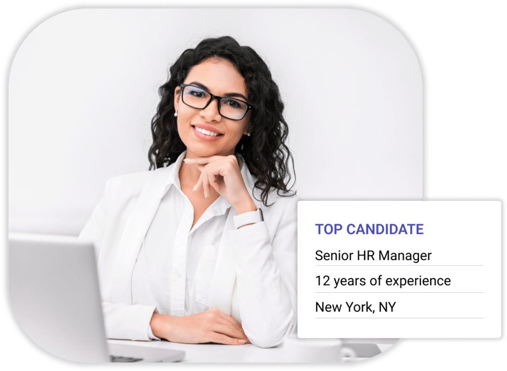 TGC Search | Senior HR Manager in white blouse next to grey computer | HR Executive Search Firms