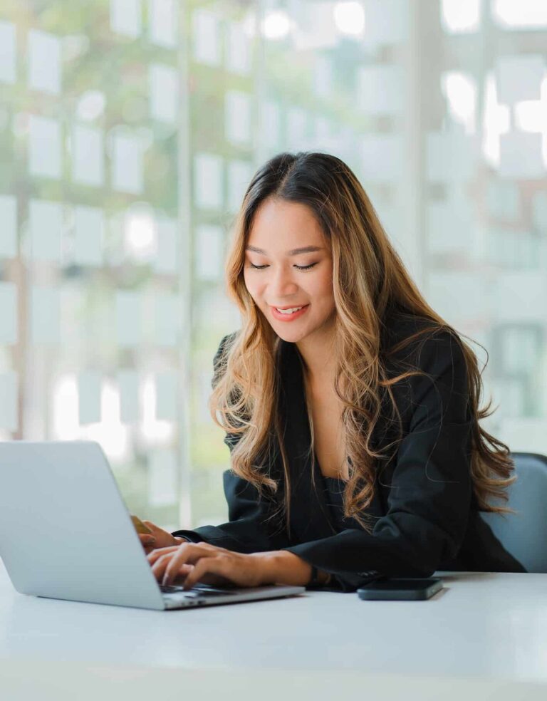 Asian business woman Working on laptop on desk | Contact Us | Submit the form