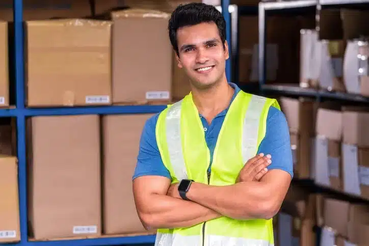 TemPositions Logistics | Picker Packer | Logistic Jobs | Man in neon vest standing in a warehouse
